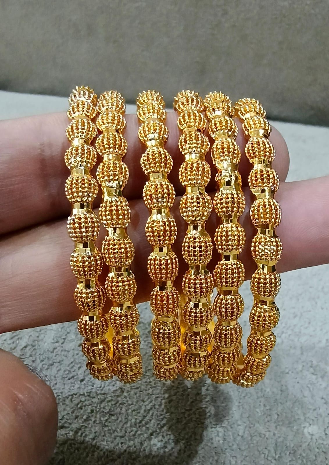 Golden Oval Textured Bangle Set